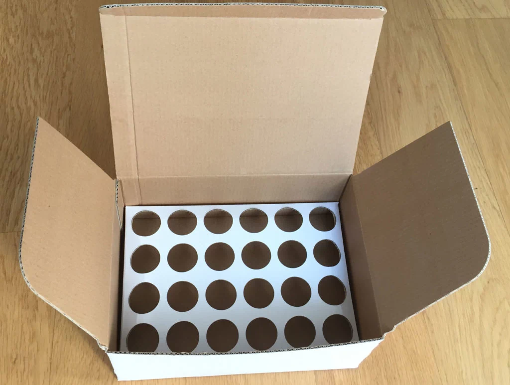 corrugated insert with round cuts or holes