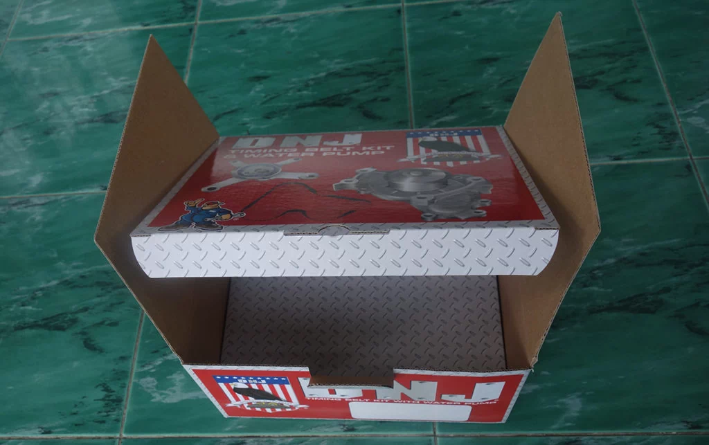 E flute corrugated box with paperboard insert